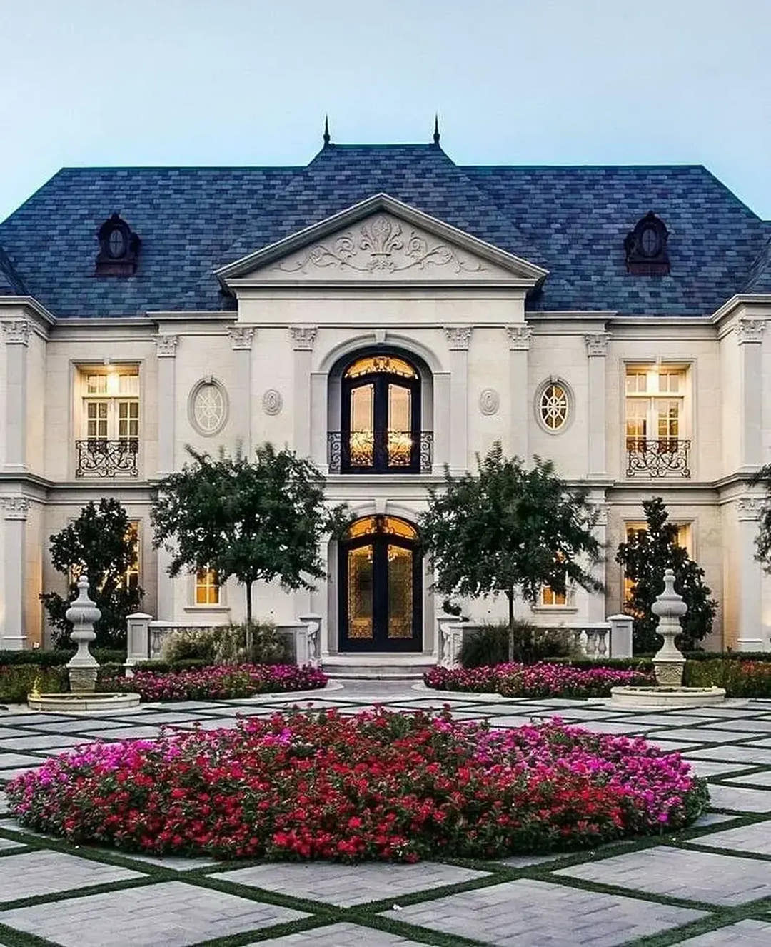 Villa front with exterior cornices, window surrounds and columns