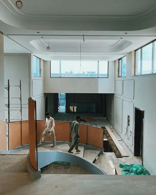 Site team at work in a double-height hall